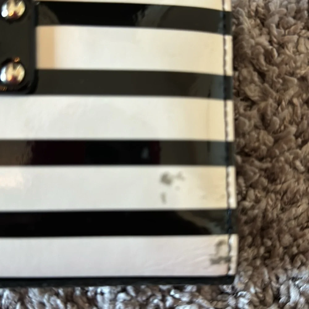 Striped black and white, shiny Kate Spade card wallet